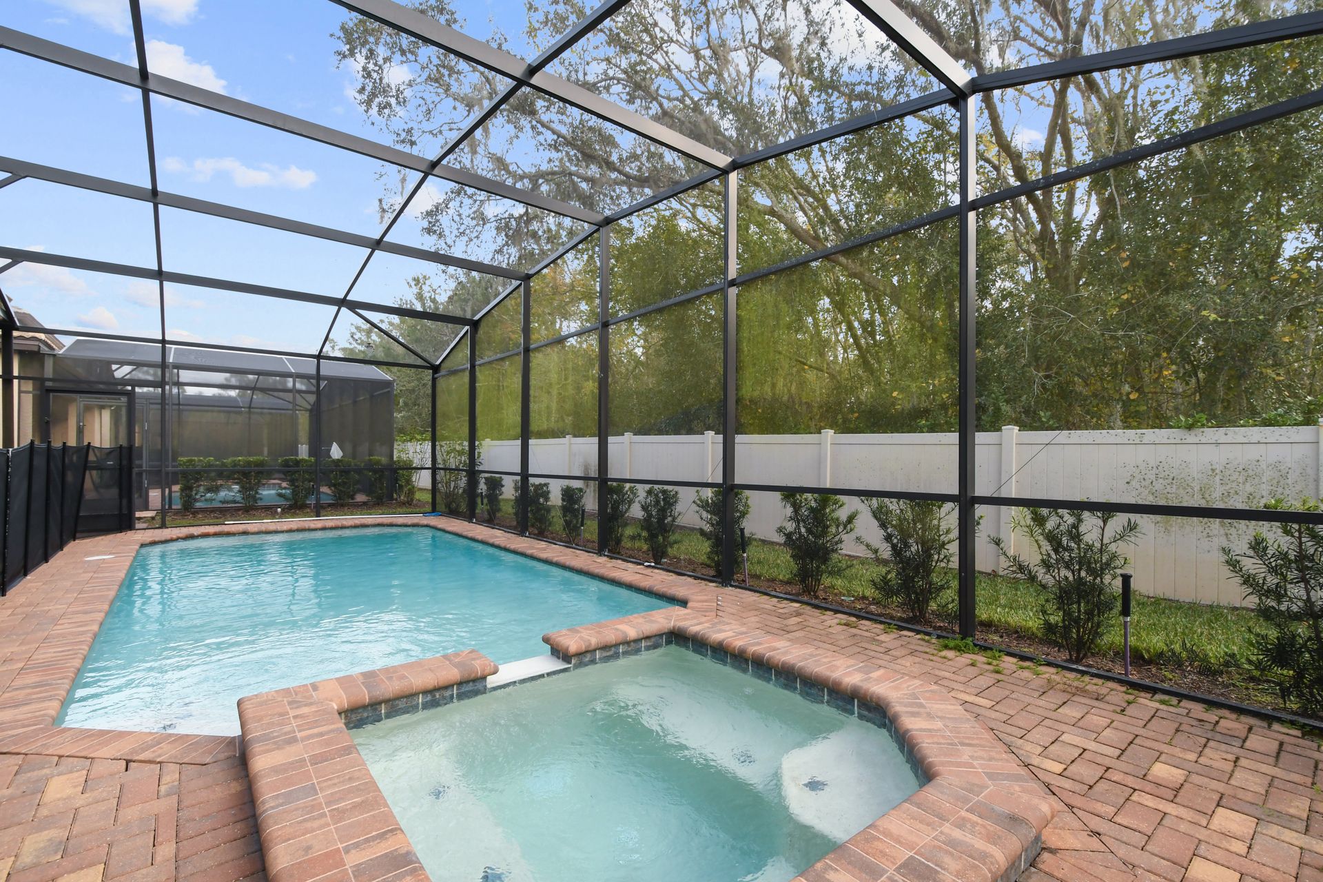 Unwind in a screened pool and spa with private, peaceful views and cozy vibes.