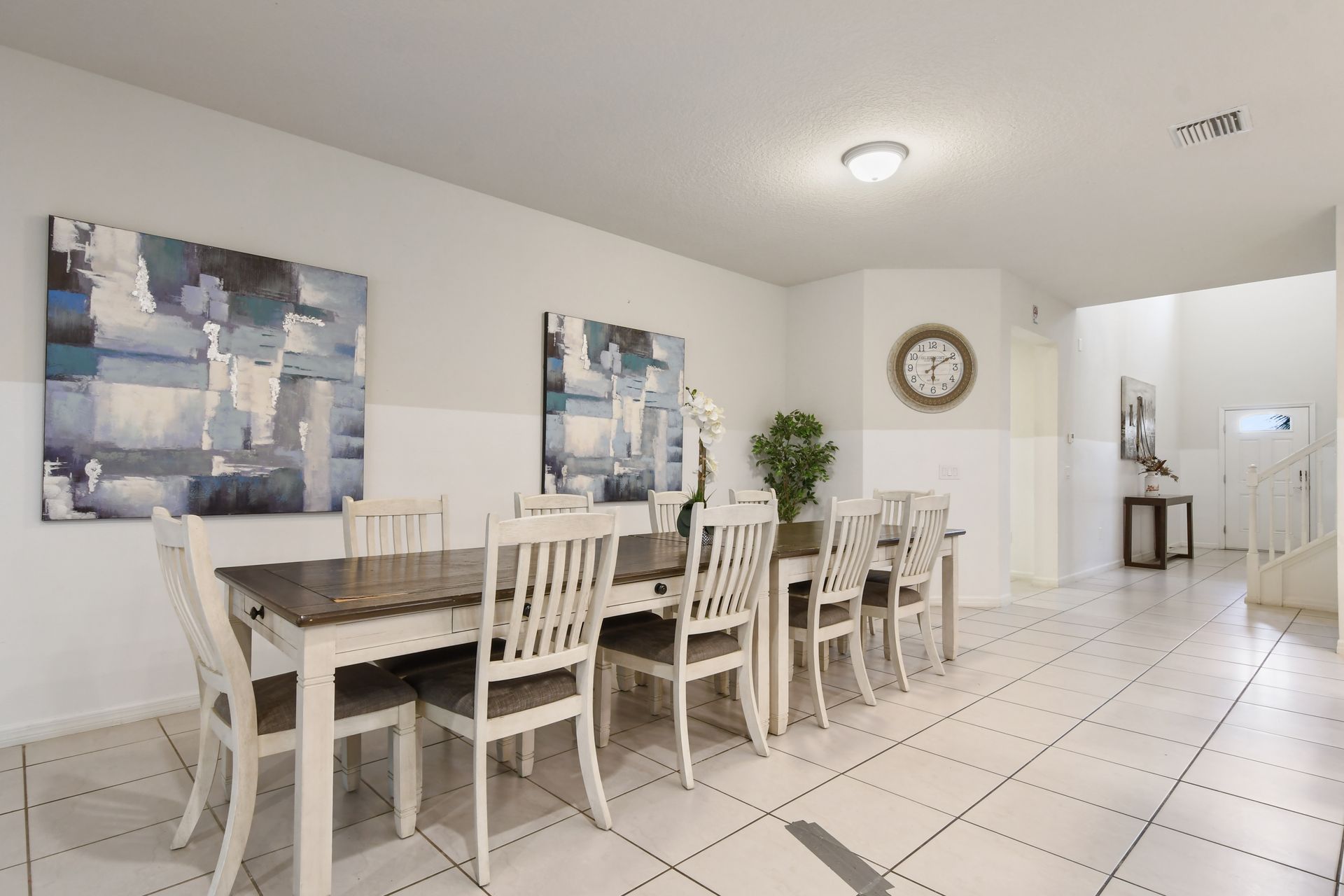 Chic dining area with seating for ten, perfect for group meals and entertaining.