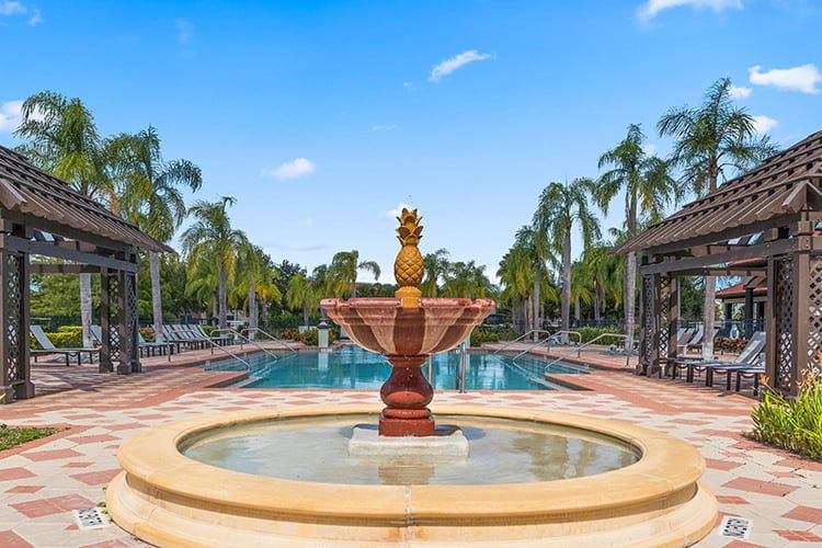 Charming fountain overlooking the serene Bella Vida community pool.