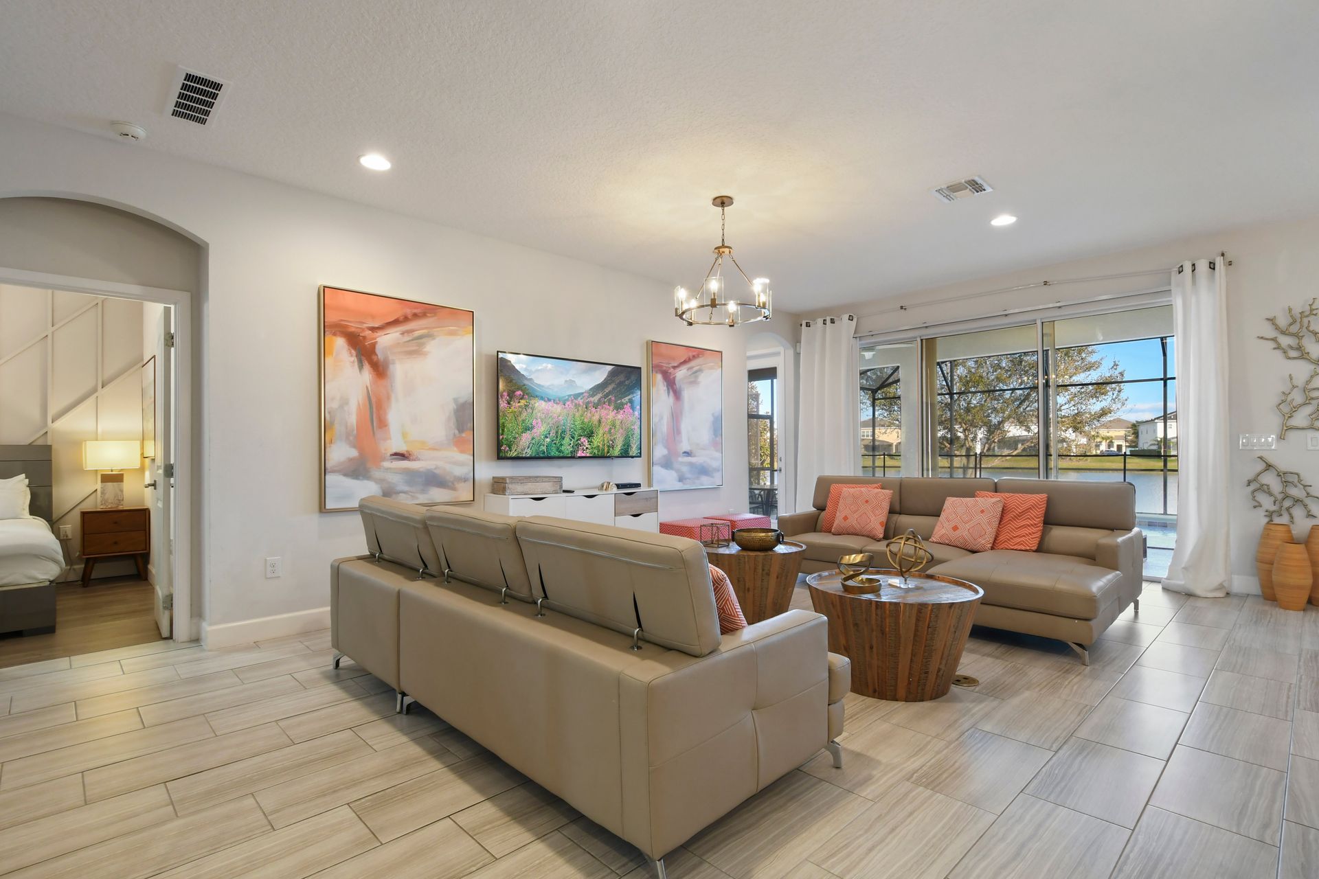 Bright, open living space with lake views, modern decor, and comfort