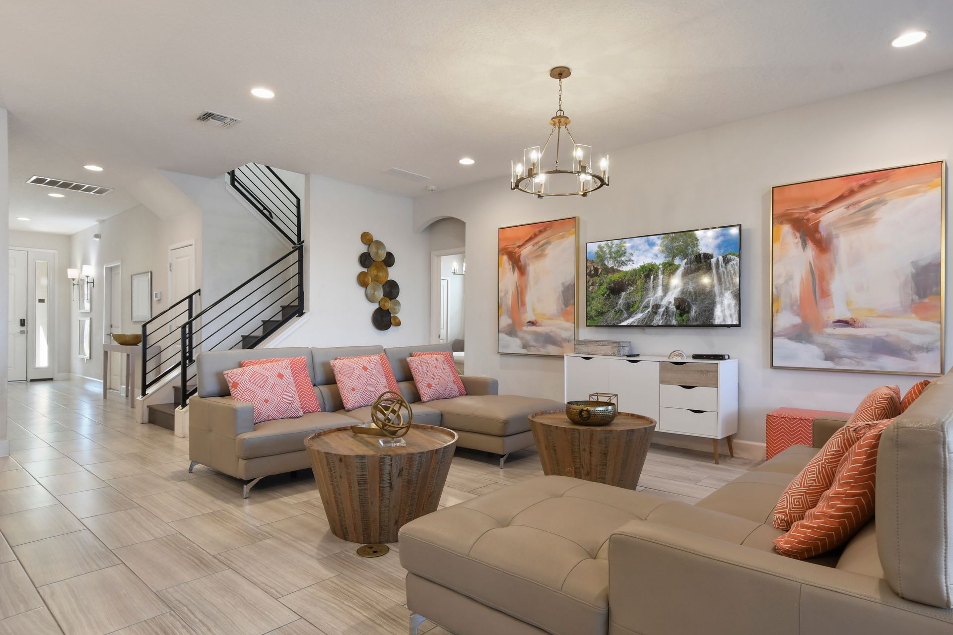 Modern living room with cozy seating, chic decor, and smart TV