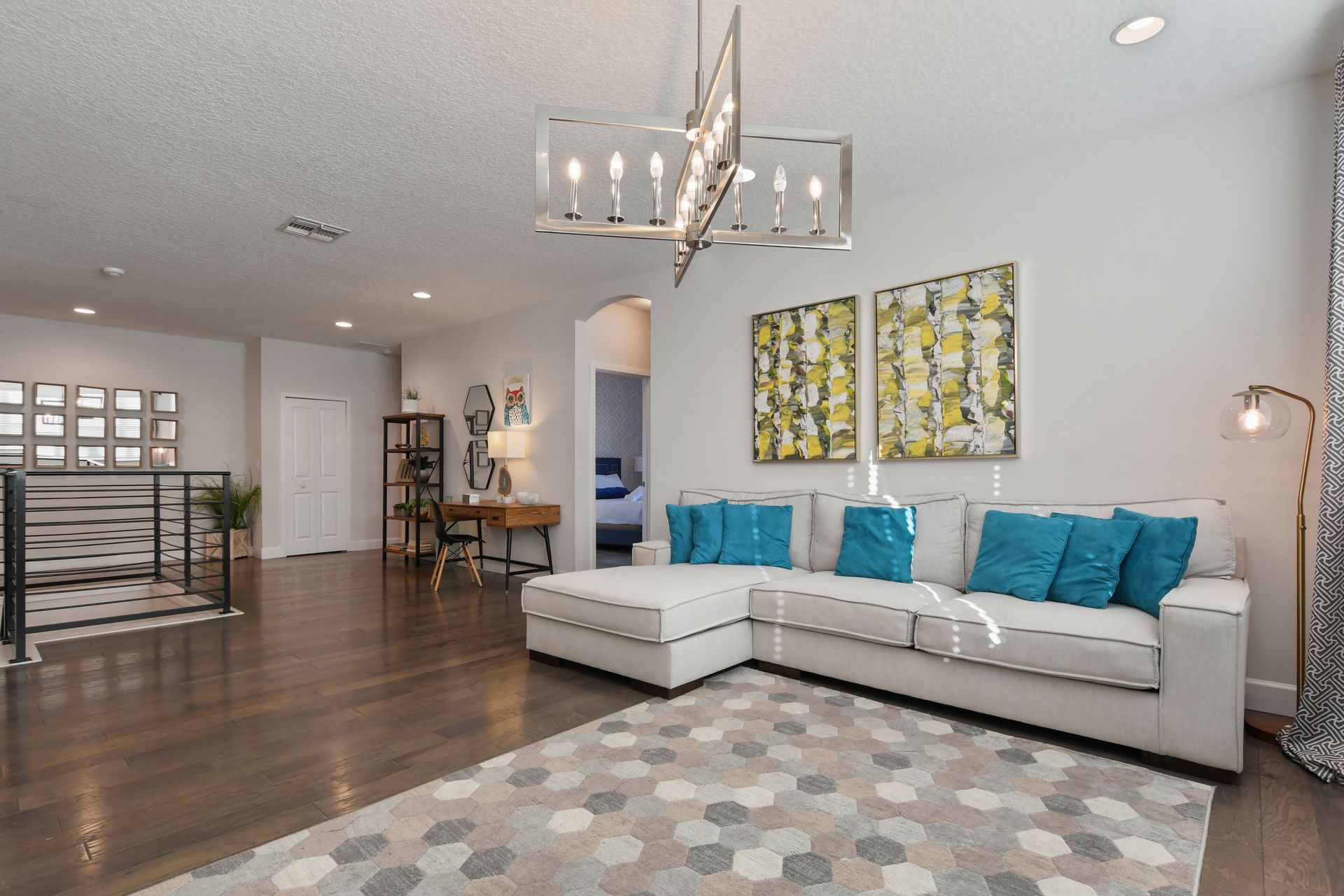 Bright loft space with cozy seating, modern decor, and workspace