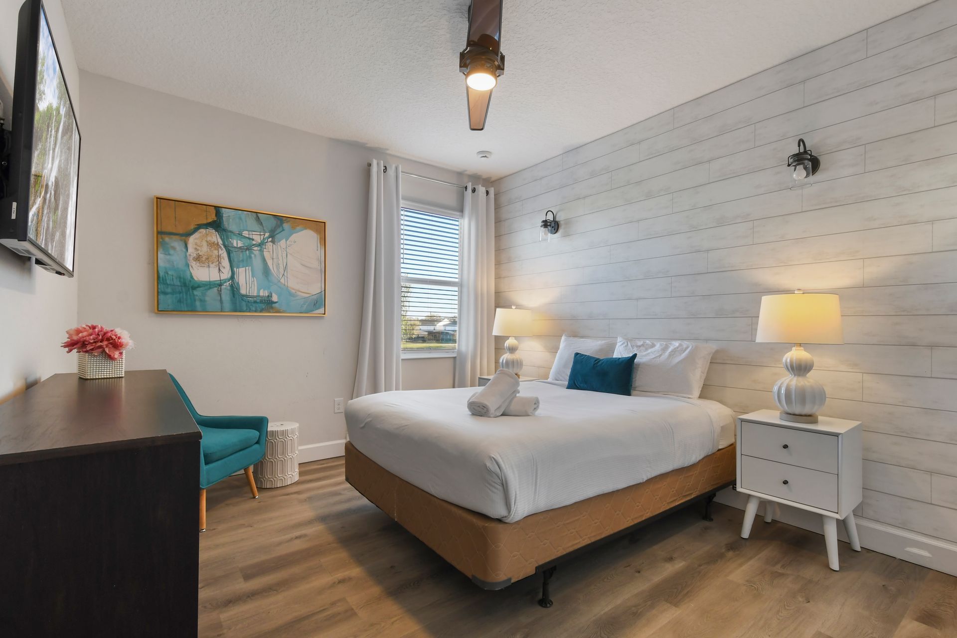 Cozy bedroom with rustic shiplap walls, modern decor, and soft lighting