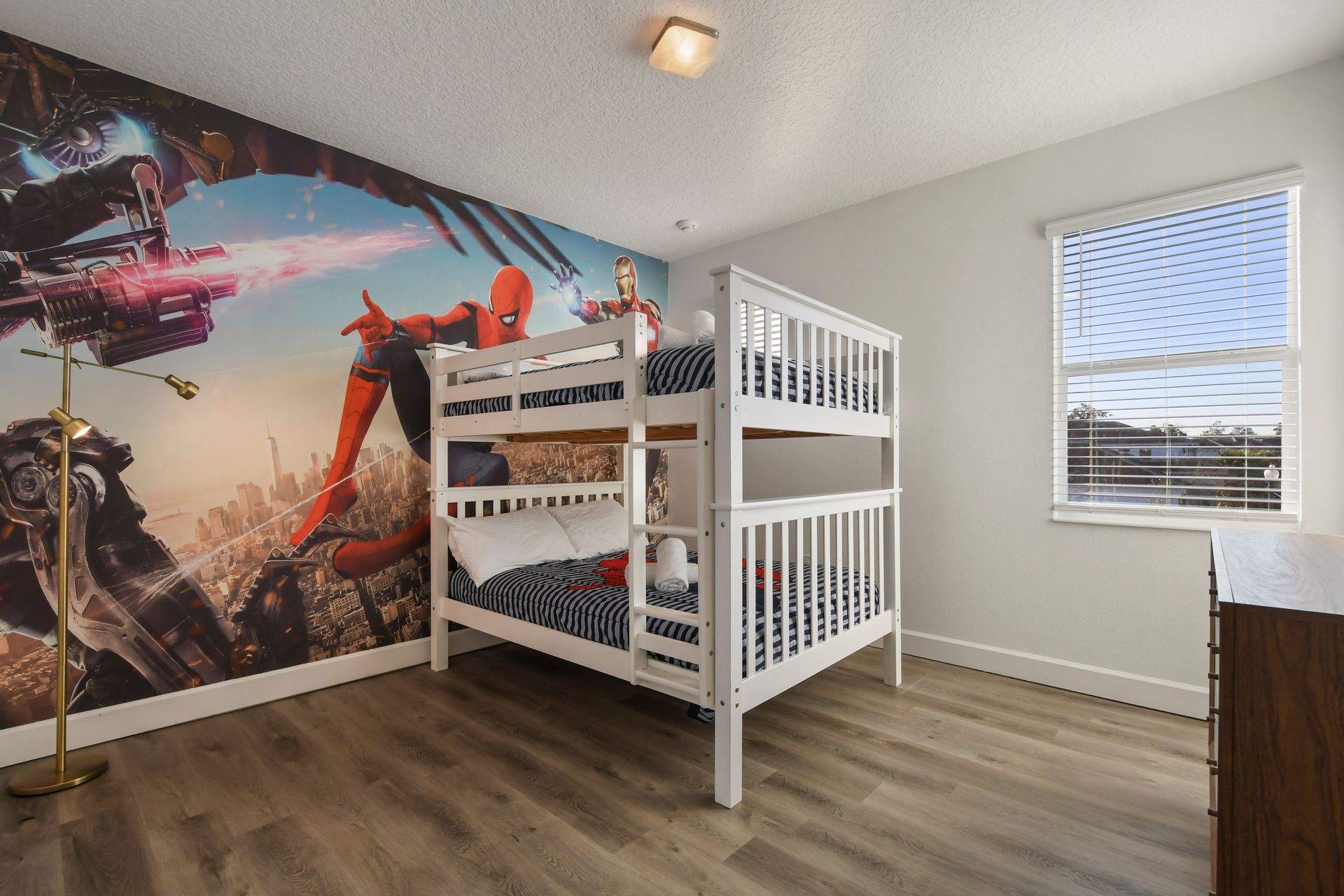 Action-packed superhero-themed bedroom with cozy bunk beds