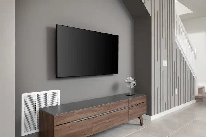 Sleek modern TV setup with mid-century console and bold accent wall design.