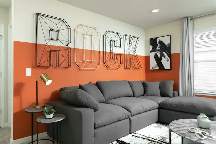 Bold “ROCK” wall art and cozy sectional make this lounge space stand out.