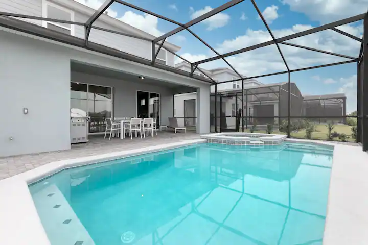 Relax in your private screened pool with spa, grill, and outdoor dining area.
