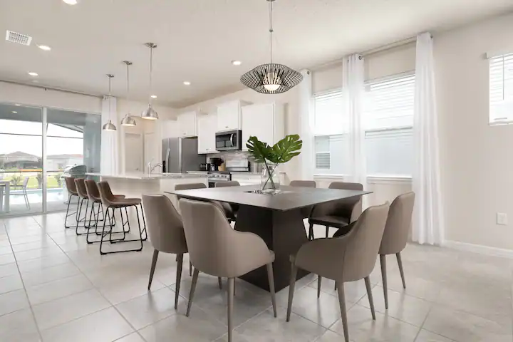 Sleek open-concept kitchen and dining area with stylish décor and natural light.