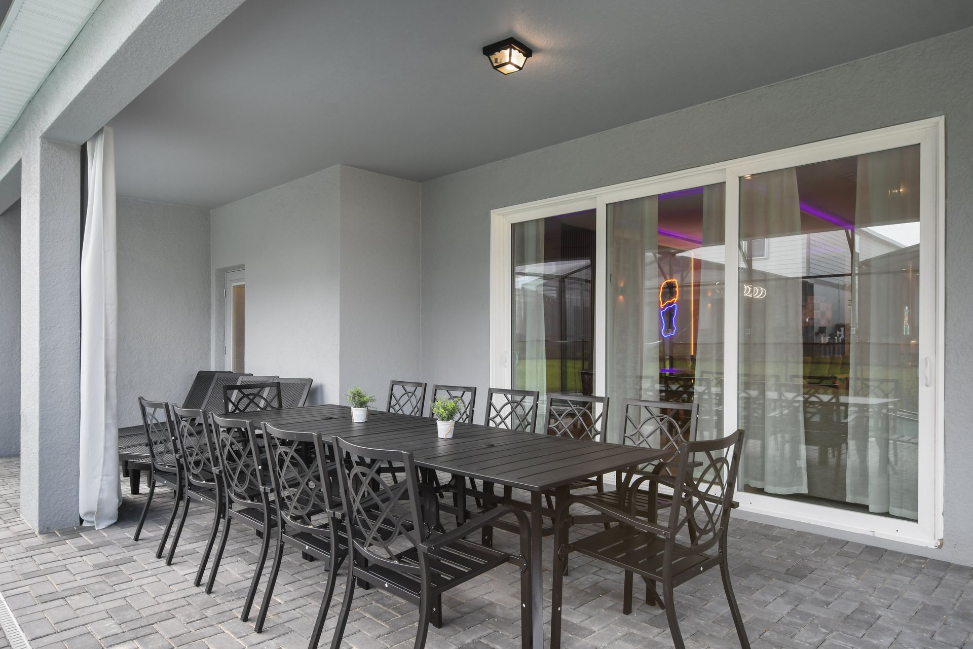 Outdoor dining space on the covered patio, ideal for group gatherings.