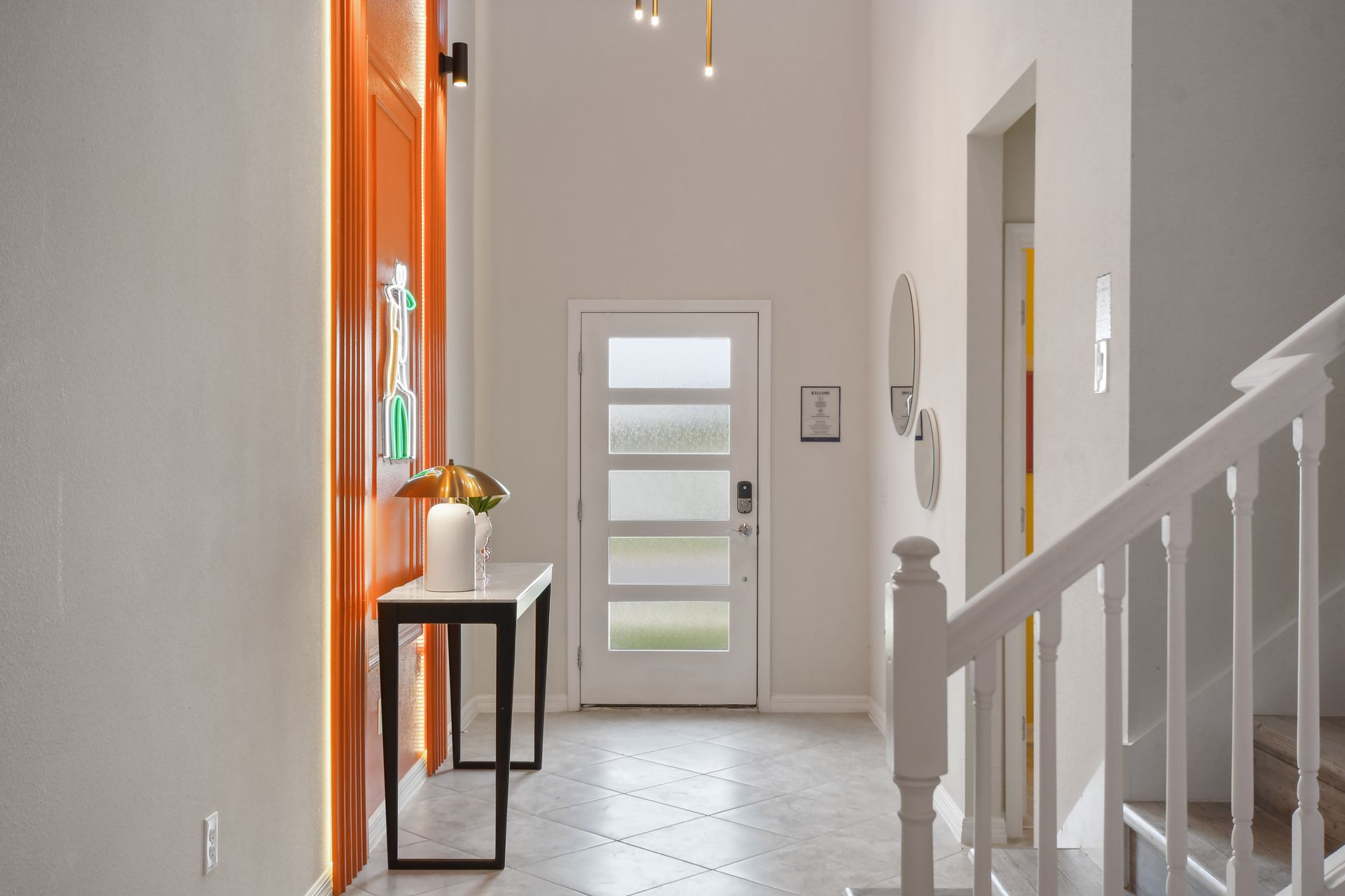 Bright entryway with modern decor and a welcoming atmosphere.