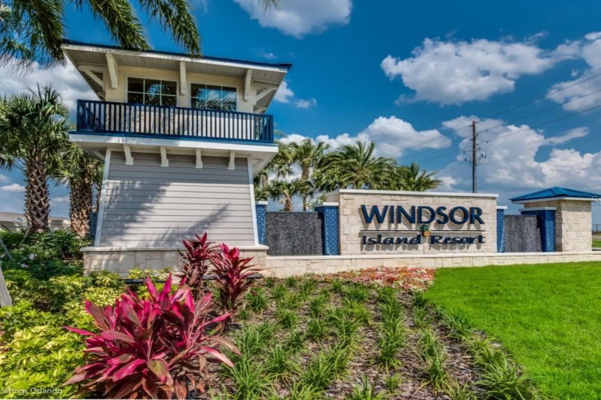 Welcome to Windsor Island Resort—lush landscaping, modern entrance, and a warm vacation vibe.