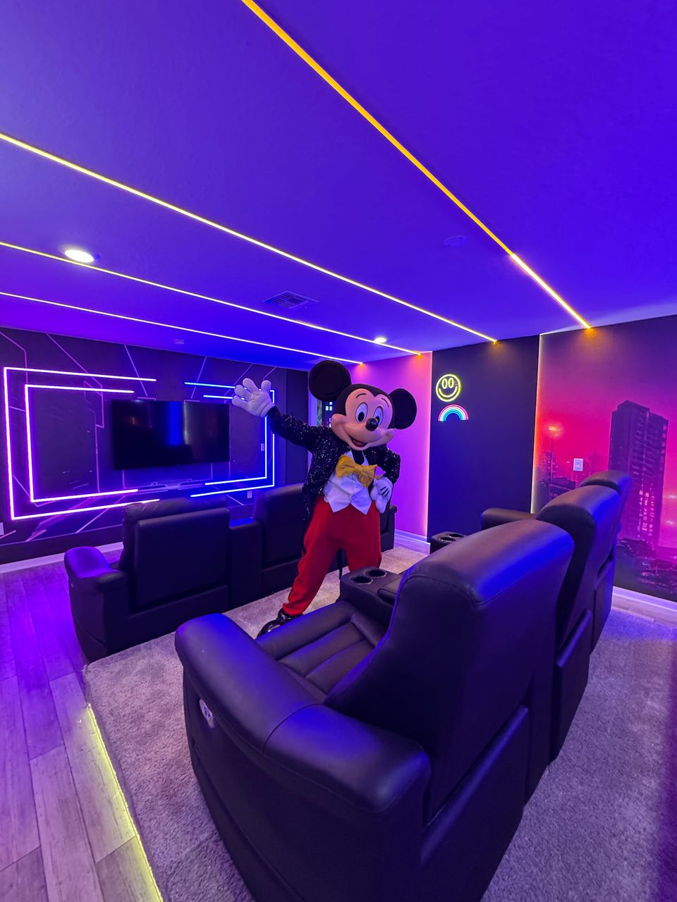 Futuristic home theater with neon vibes, recliners & Disney magic!