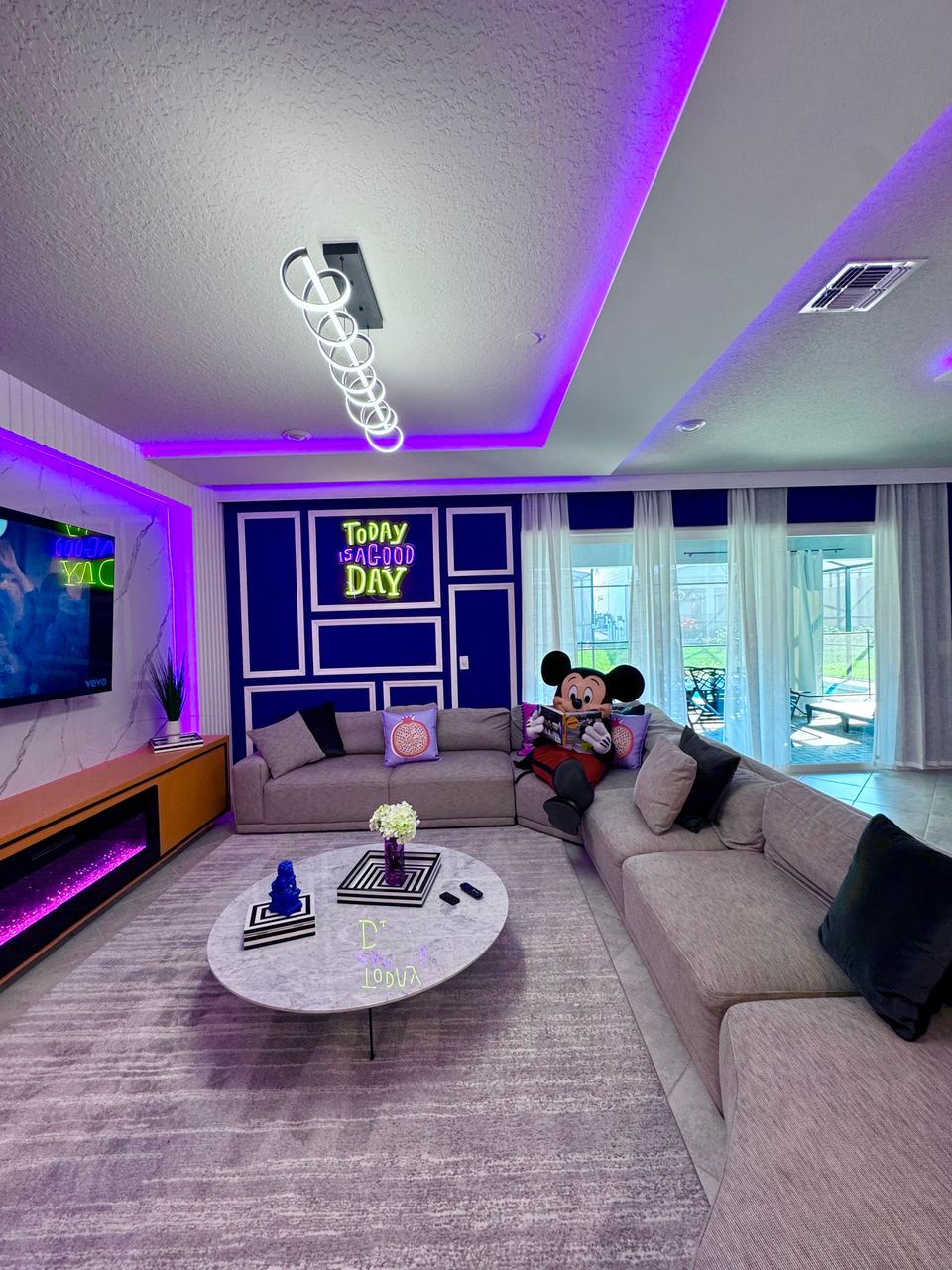 Stylish lounge with cozy vibes, neon glow, and character magic!