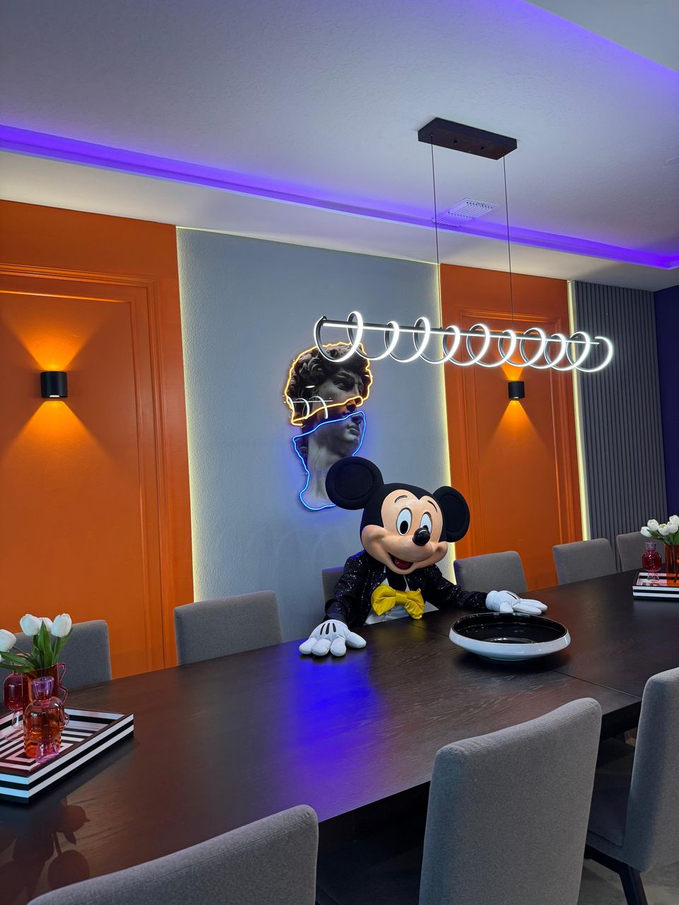 Modern dining space with bold colors, neon art & Disney magic!