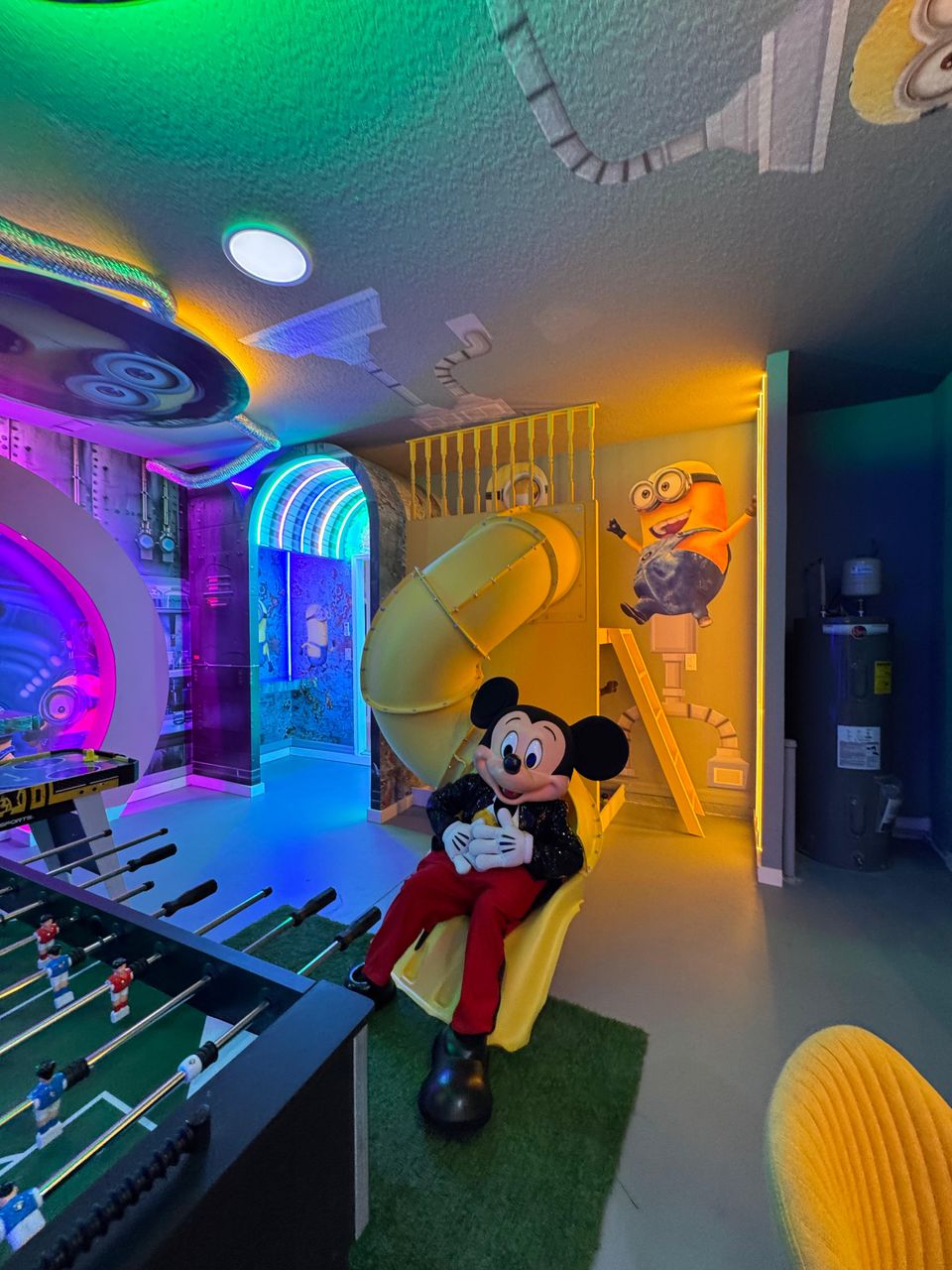Colorful playroom with slides, foosball, and themed adventures!