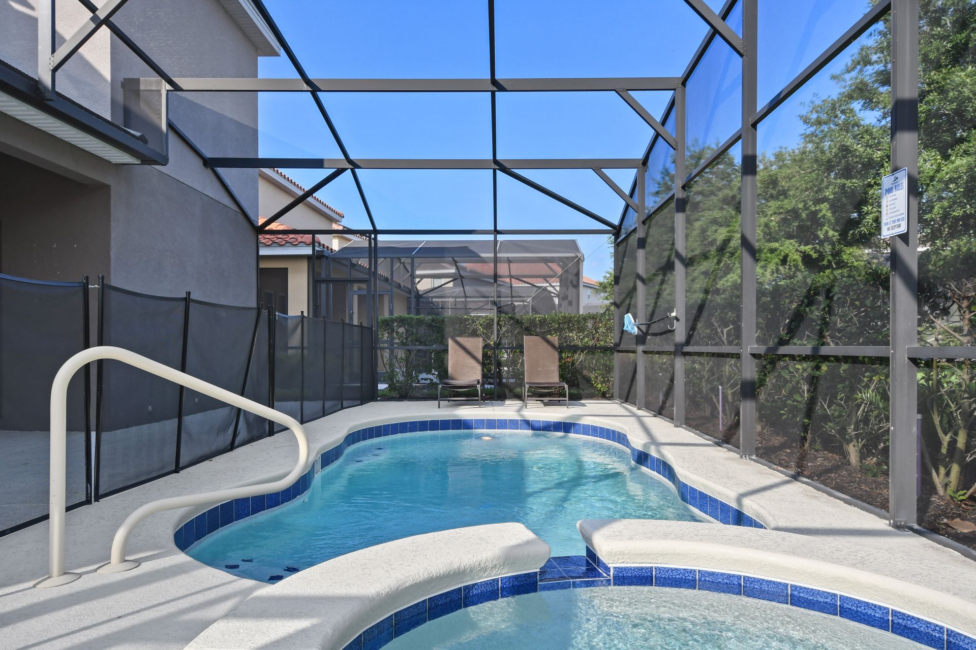 Soak up the sunshine or unwind in the spa—this private screened pool area is perfect for a refreshing dip or laid-back lounging in total comfort.