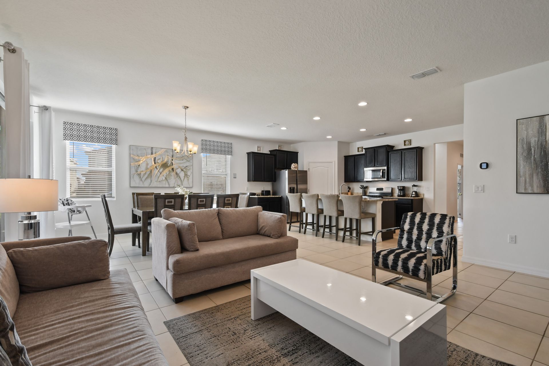 Experience comfort and convenience in our well-appointed living room, designed for your relaxation.