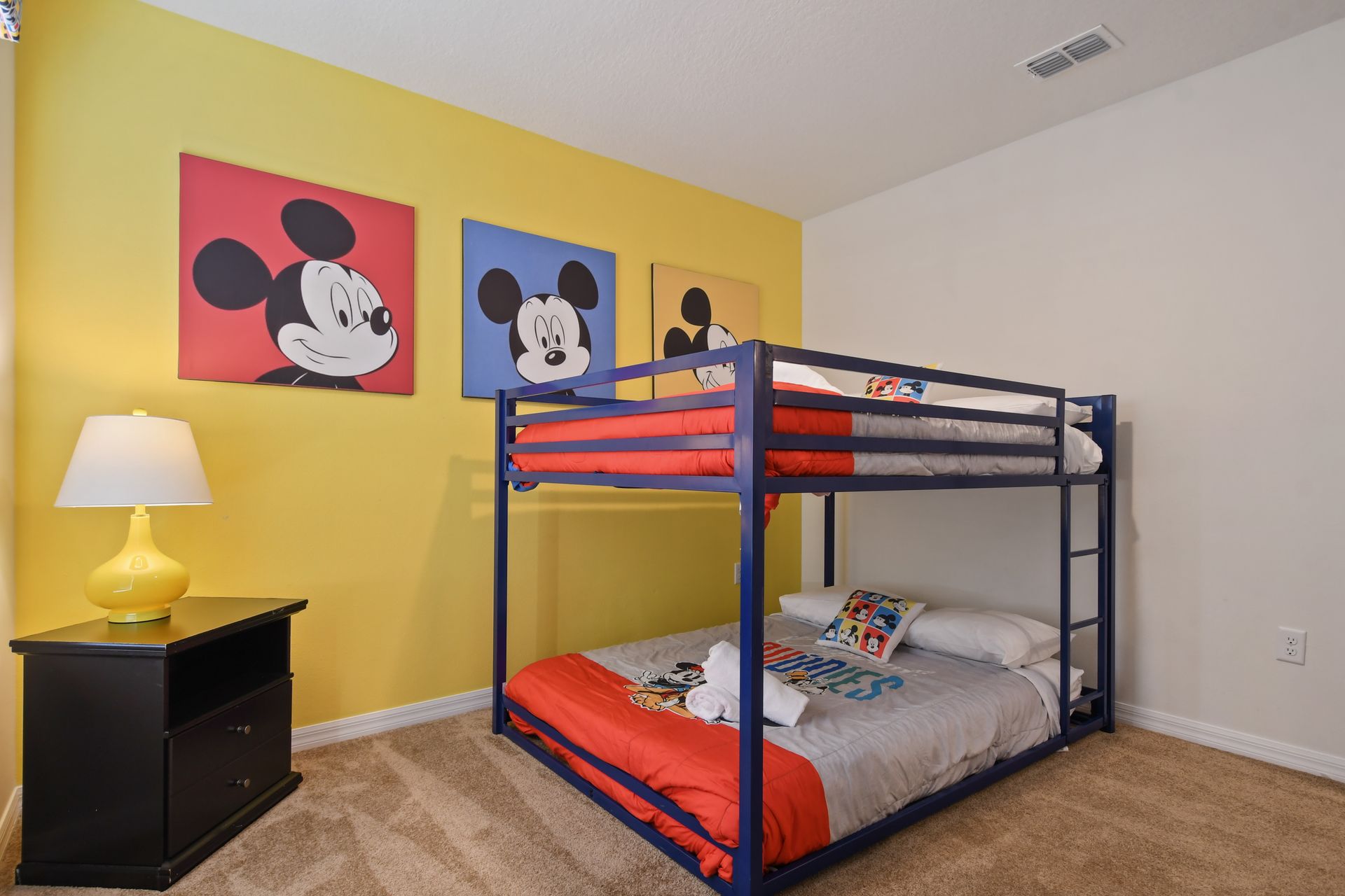 Drift into a peaceful sleep in our cozy Mickey Mouse themed bedroom, ensuring a restful night's sleep during your stay.