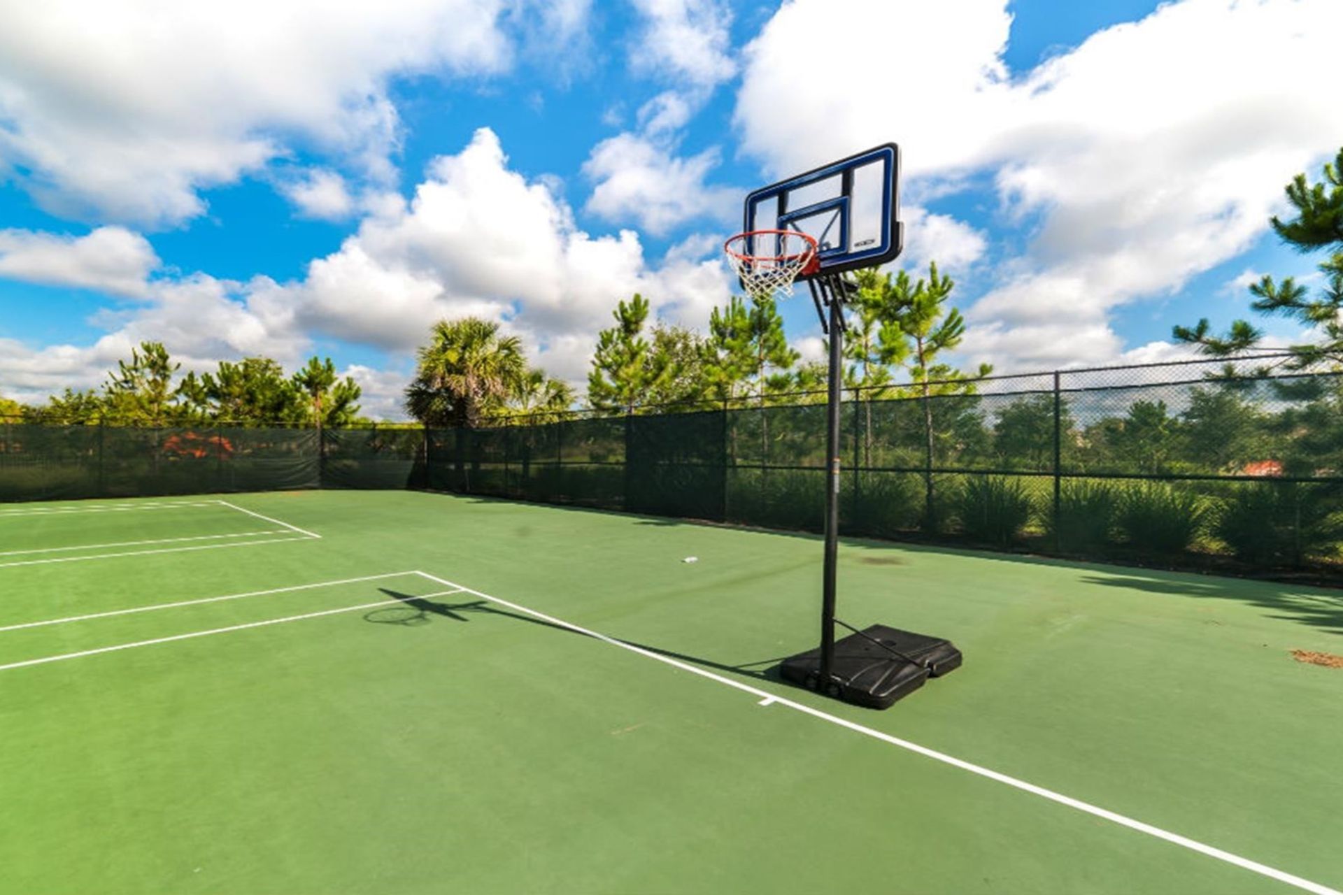 Challenge your friends to a match on the resort's tennis court, offering you a thrilling way to stay active and enjoy the outdoors during your stay.