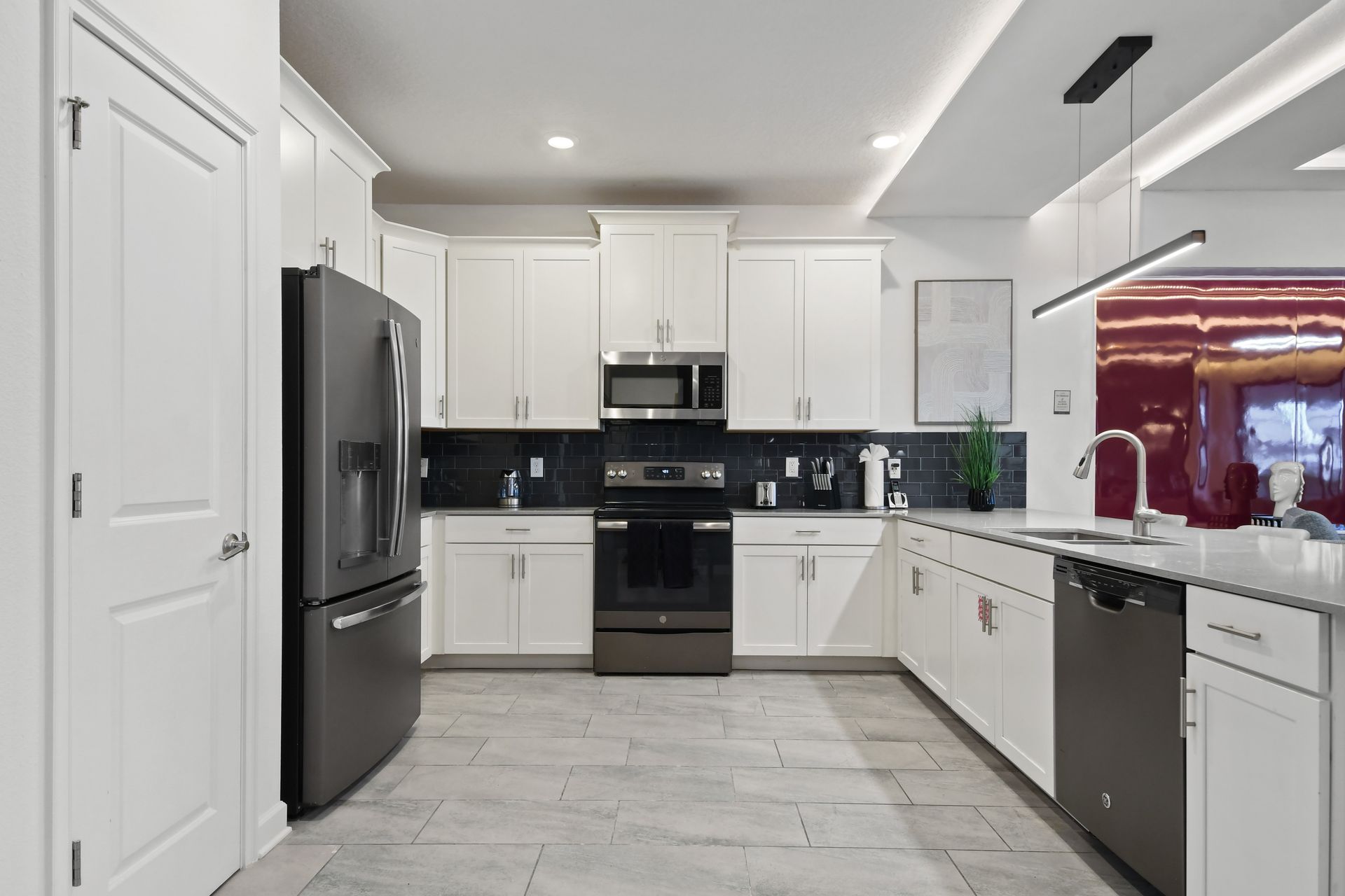 Cook in style in this sleek modern kitchen with quartz counters and stainless steel!