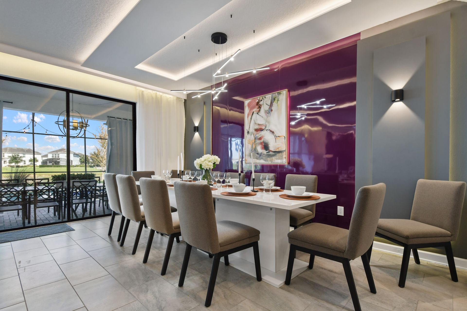 Dine in elegance in this stunning modern space with bold art and patio views!