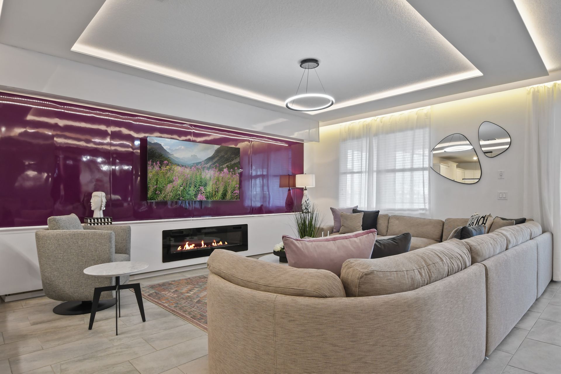 Unwind in style in this chic modern living room with a fireplace and luxe seating!