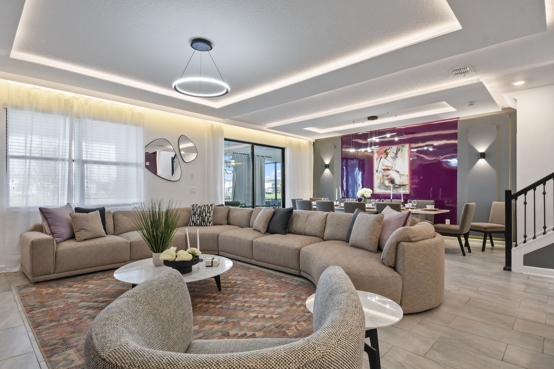 Unwind in style in this chic modern living room with a fireplace and luxe seating!