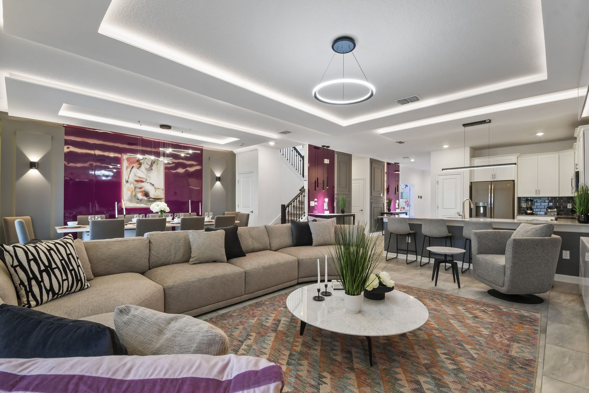 Unwind in style in this chic modern living room with a fireplace and luxe seating!