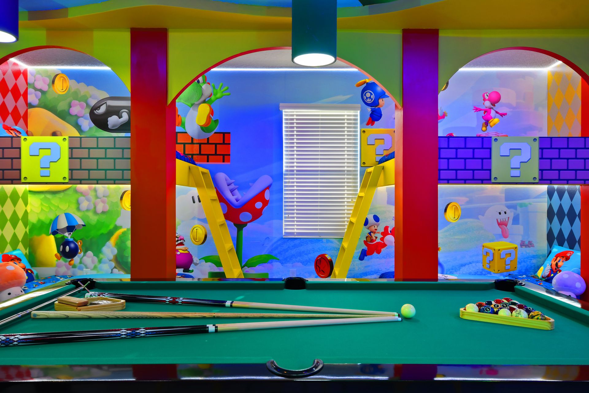 Jump into the ultimate Super Mario game room with arcades, pool, and bold colors!