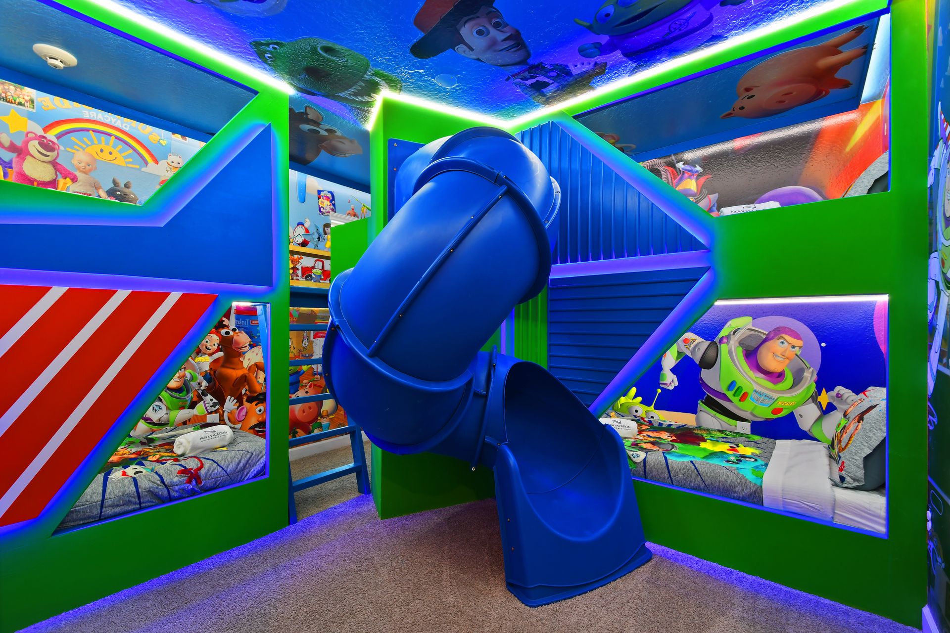 Blast off into fun in this epic Toy Story-themed bunk room with a spiral slide!