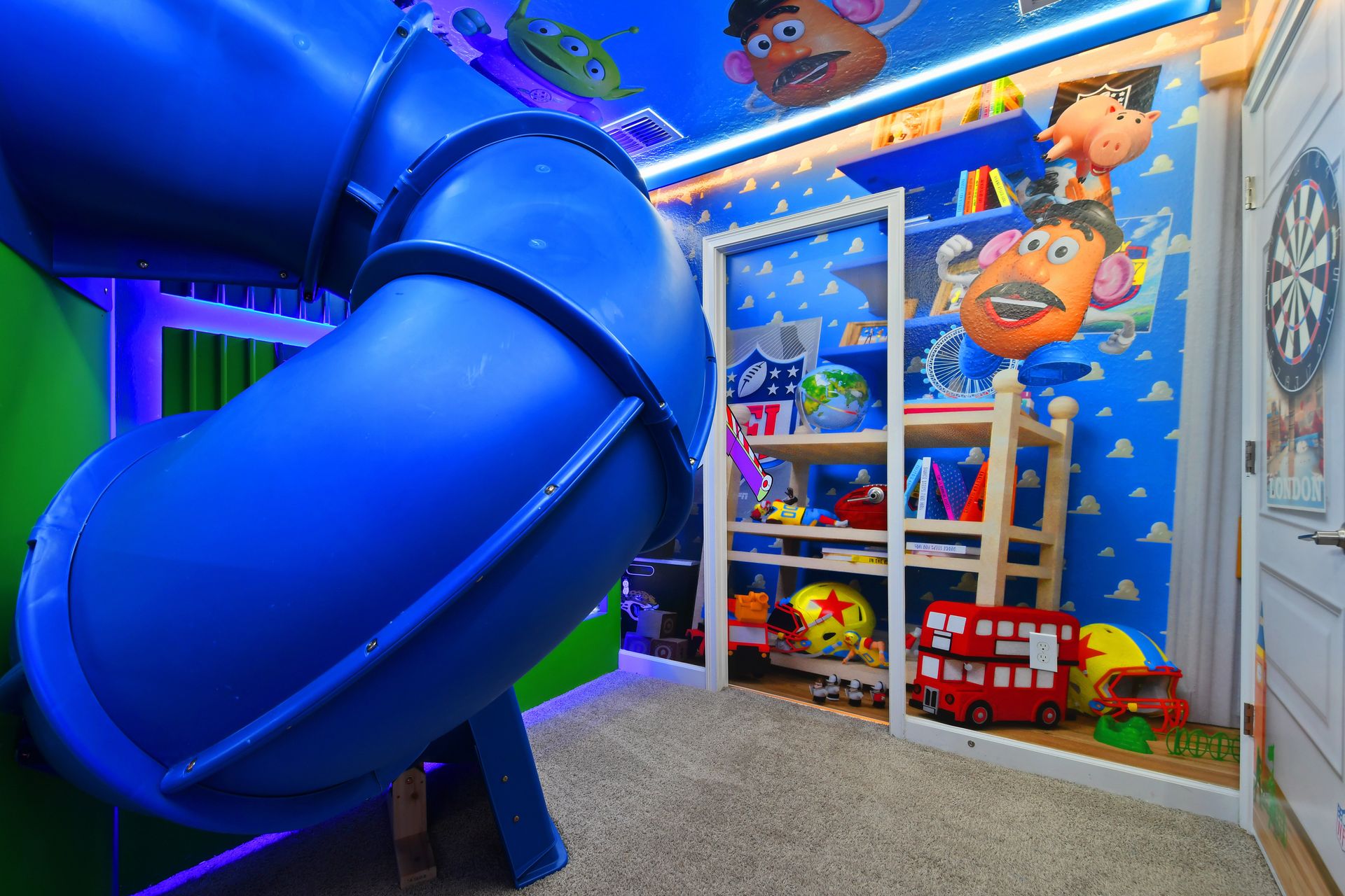 Slide into adventure in this Toy Story-themed room with bunk beds and bold colors!