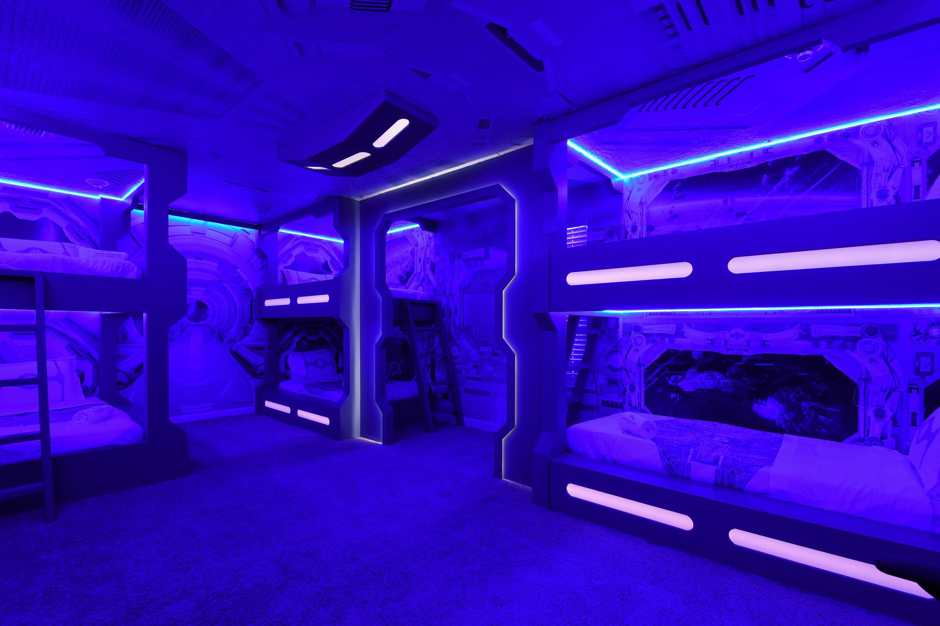 Blast off to dreamland in this space-themed bunk room built like a starship cabin!