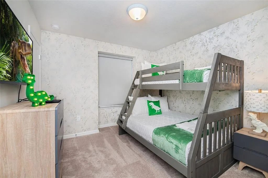 Dino-themed bunk room with cozy vibes, perfect for little adventurers' stay.