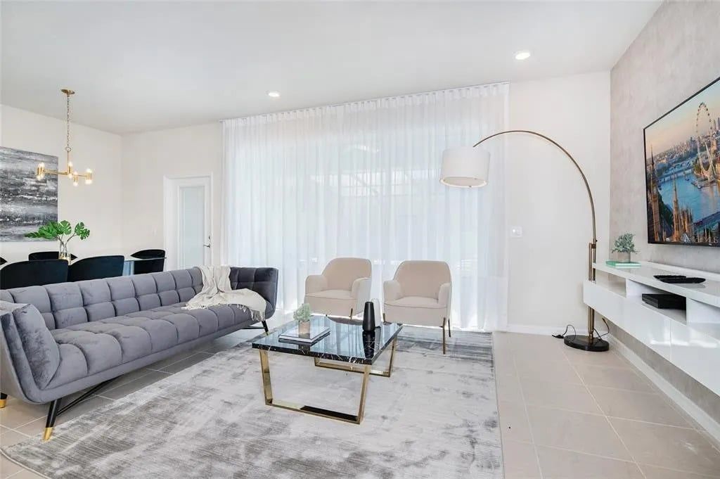 Modern lounge with chic décor, plush seating, and tons of natural light.