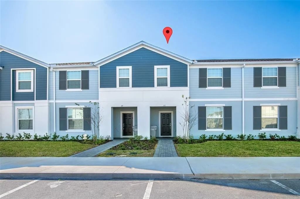 Modern townhouse with stylish exterior, private entry, and convenient parking.