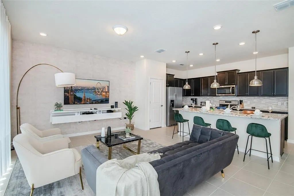 Stylish open-concept retreat with modern kitchen and cozy living space.