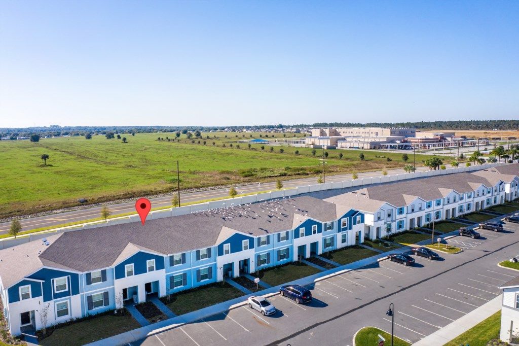 Modern townhouse with stylish exterior, private entry, and convenient parking.