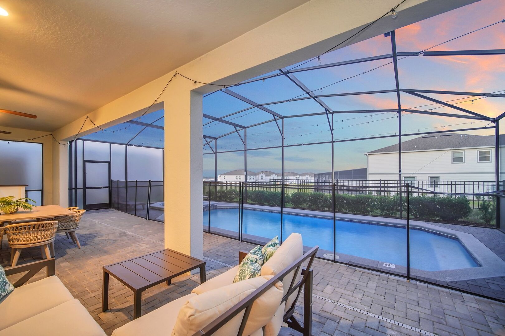 Enjoy the sunset poolside from the comfort of this cozy, covered patio.