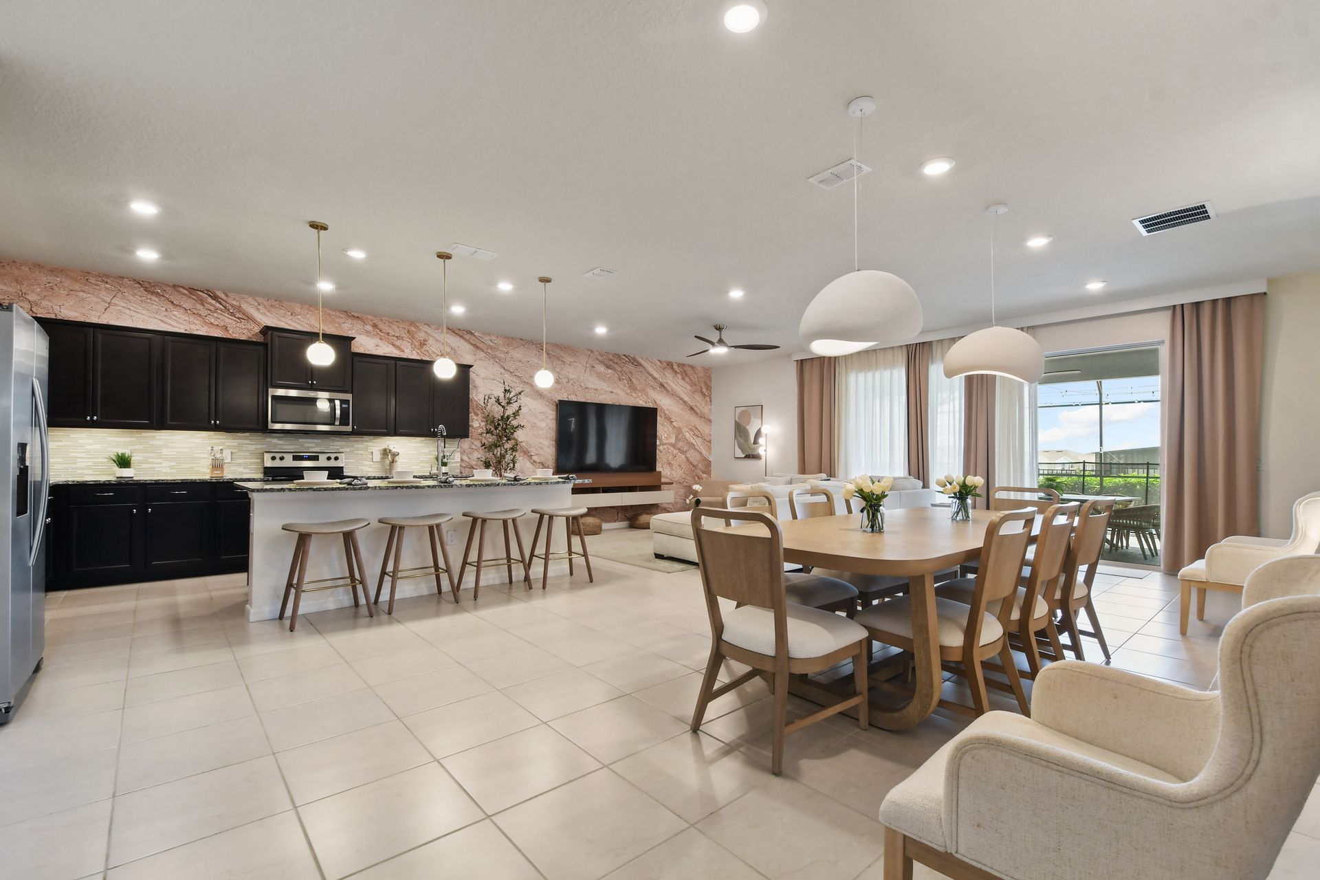 Spacious open-concept living, dining, and kitchen area with elegant modern touches!