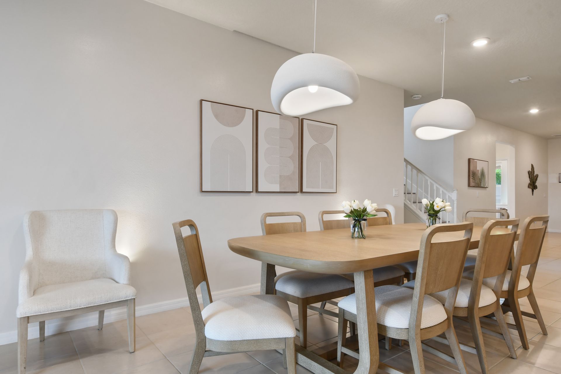 Elegant dining space with seating for eight, chic decor, and cozy ambiance!