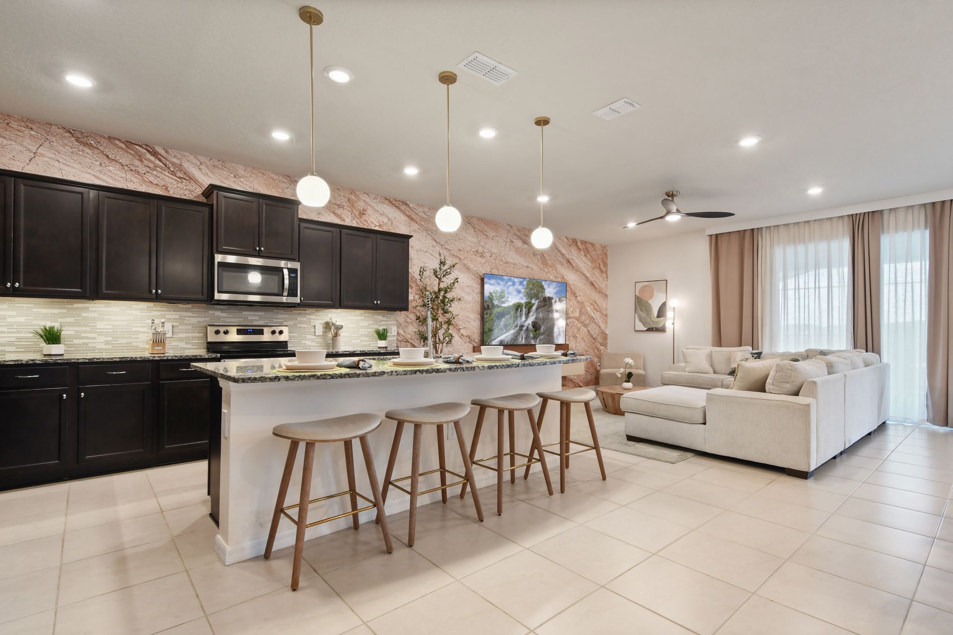 Open-concept kitchen & living area with sleek design, cozy seating, and modern flair!