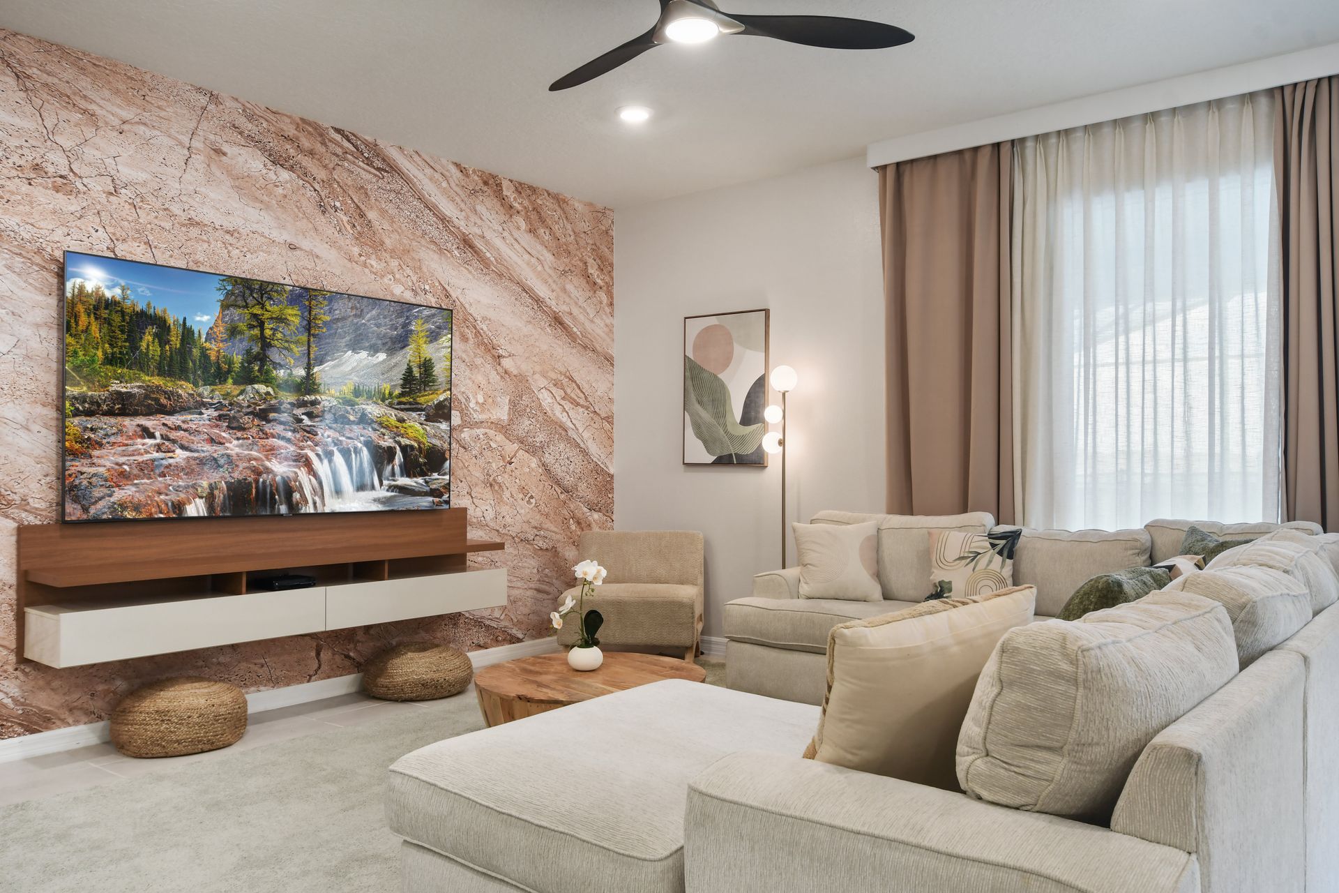 Relax in this stylish living room with a cozy sectional and a stunning TV setup!