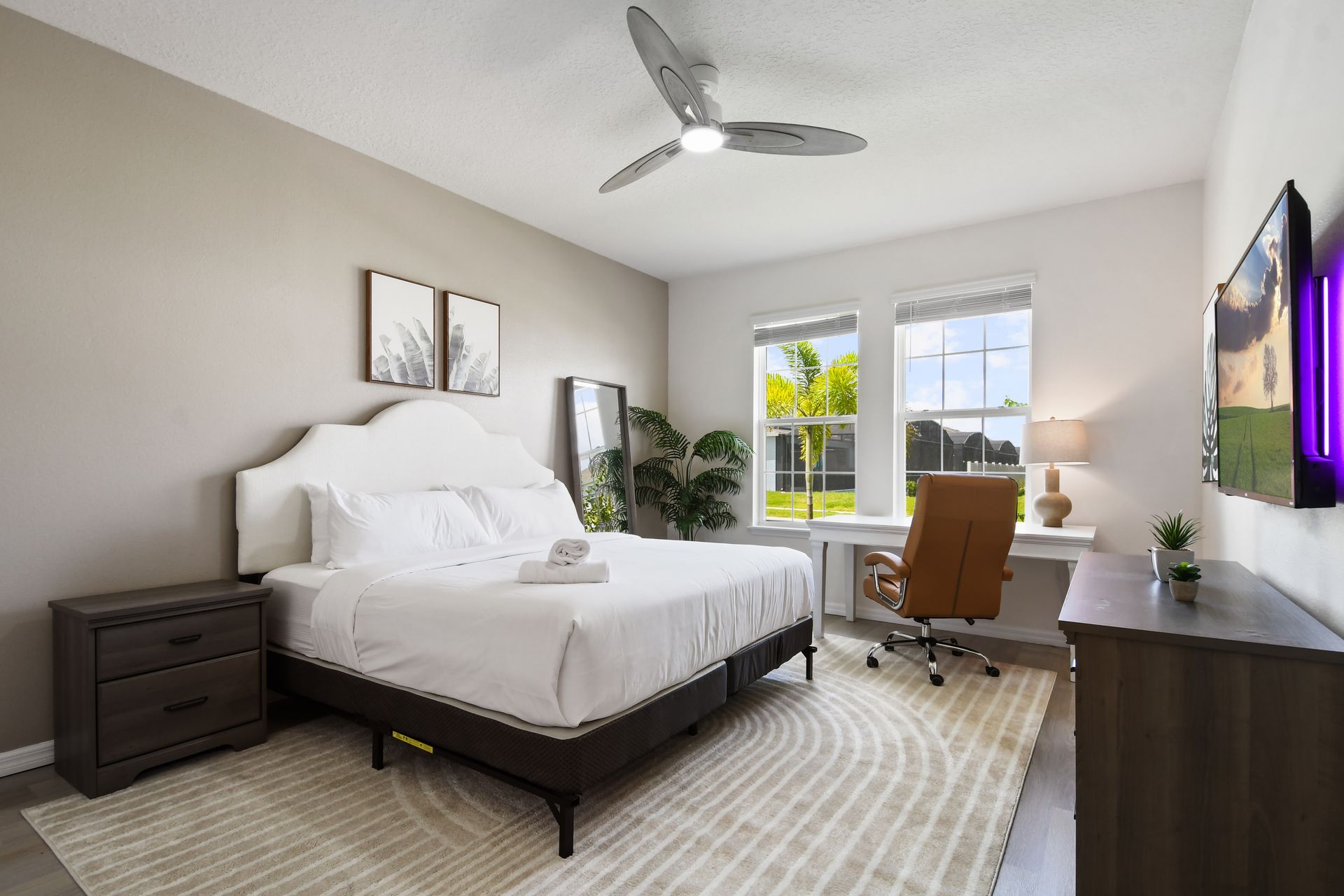 Bright bedroom with a king bed, workspace, and relaxing views!