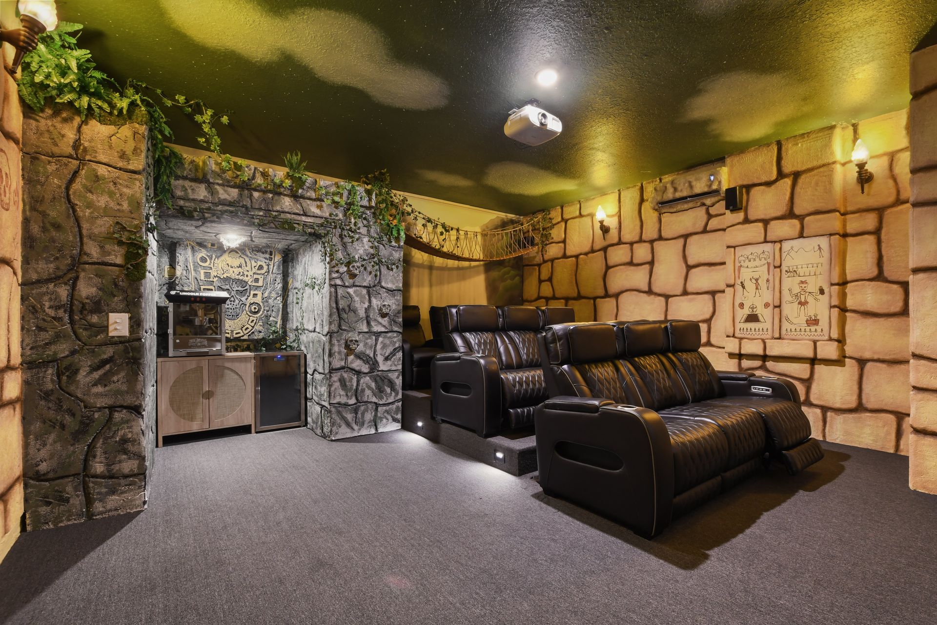 Adventure-themed home theater with recliners and popcorn bar!