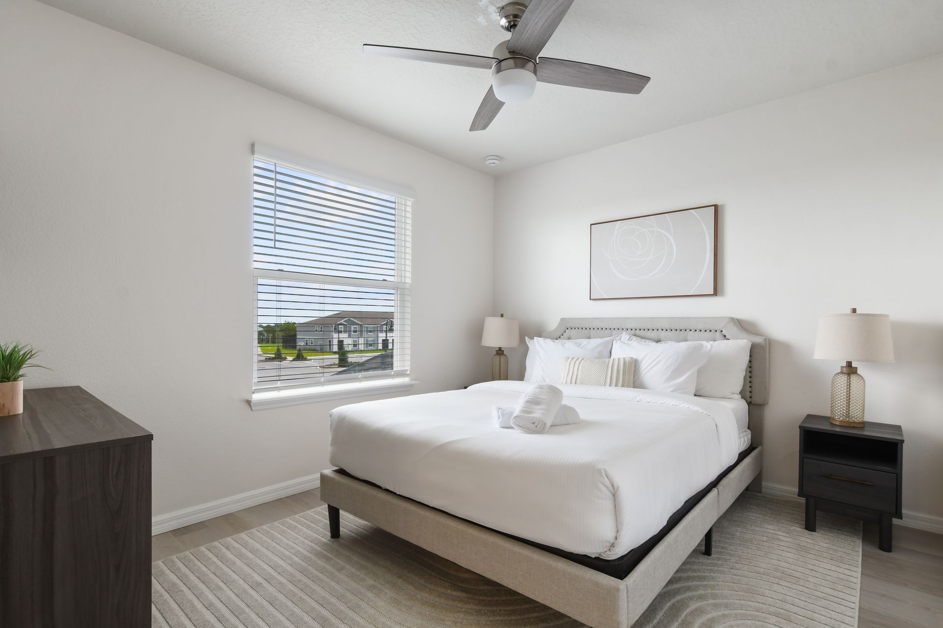 Bright and modern bedroom with a comfy bed and peaceful views!