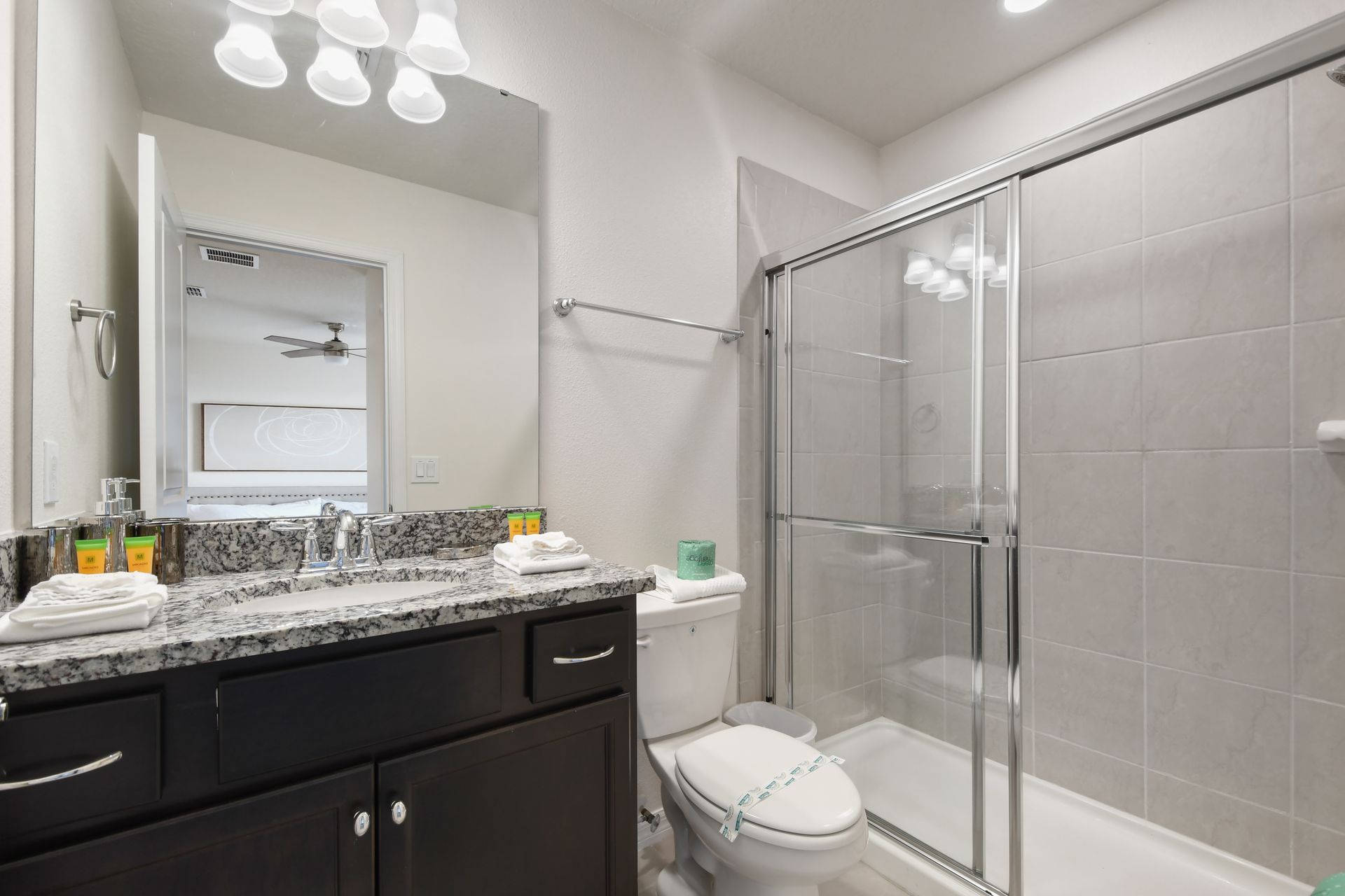 Modern bathroom with a spacious walk-in shower, vanity, and sleek finishes!