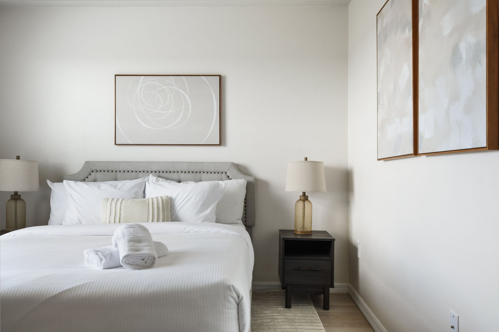 Minimalist bedroom with soft lighting and a cozy, elegant vibe!