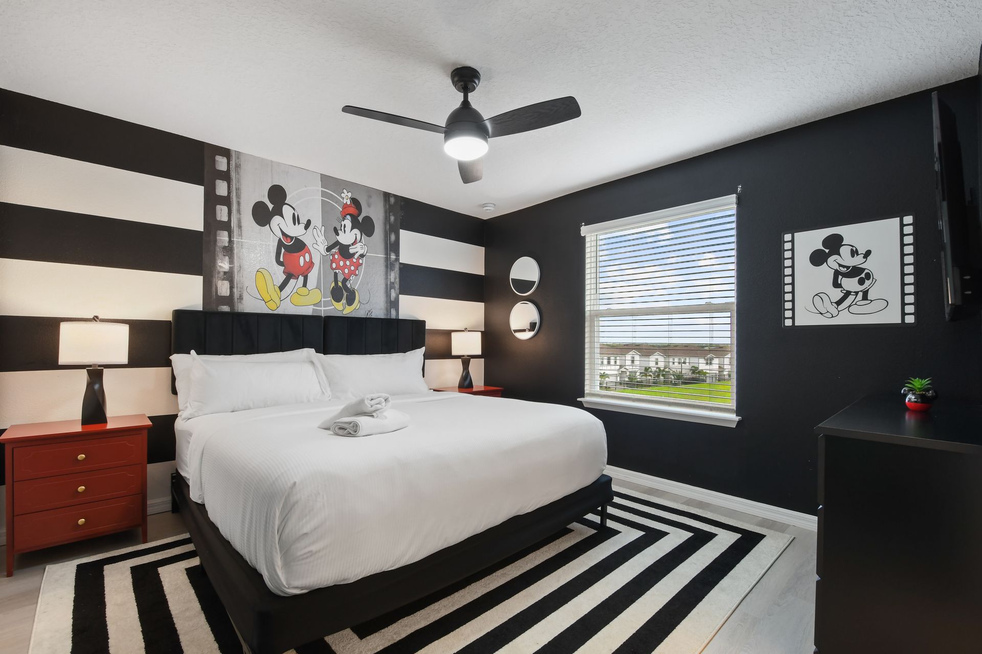 Stylish Mickey Mouse-themed room with bold stripes and charm!