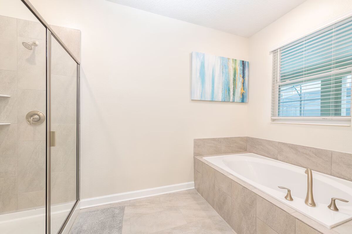 Spa-inspired bathroom with walk-in shower, soaking tub, and calming modern design.